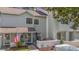 Two-story townhome with American flag and landscaped yard at 23 Shadow Moss Pl. # 23, North Myrtle Beach, SC 29582