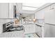 Modern kitchen featuring white shaker cabinets, granite countertops, and stainless steel appliances at 23 Shadow Moss Pl. # 23, North Myrtle Beach, SC 29582