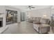 Bright living room with hardwood floors, a comfy couch, and sliding glass doors leading to a patio at 23 Shadow Moss Pl. # 23, North Myrtle Beach, SC 29582