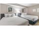 Cozy bedroom featuring two queen beds and decorative artwork at 2301 S Ocean Blvd. # 1408, North Myrtle Beach, SC 29582