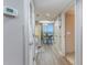 Hallway with dining table, kitchen, and sliding glass doors to patio at 2301 S Ocean Blvd. # 1408, North Myrtle Beach, SC 29582
