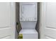 Laundry closet with stacked washer and dryer at 2301 S Ocean Blvd. # 1408, North Myrtle Beach, SC 29582