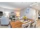 Open-concept living room and dining area with beach-themed decor and ample seating at 2301 S Ocean Blvd. # 1408, North Myrtle Beach, SC 29582