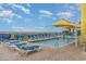 Outdoor pool area with ample seating, lounge chairs, and shaded umbrellas for residents to enjoy at 2301 S Ocean Blvd. # 1408, North Myrtle Beach, SC 29582