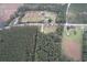 Aerial view of property showcasing surrounding land and nearby houses at 4575 Saints Delight Rd., Georgetown, SC 29440