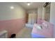 Pink tiled bathroom with shower/tub combo and vanity at 4575 Saints Delight Rd., Georgetown, SC 29440