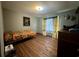 Bedroom with camo bedding and hardwood floors at 4575 Saints Delight Rd., Georgetown, SC 29440