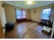 Simple bedroom with hardwood floors and two windows at 4575 Saints Delight Rd., Georgetown, SC 29440