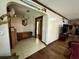 Long hallway with wood flooring leading to bedrooms and bath at 4575 Saints Delight Rd., Georgetown, SC 29440