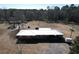 Ranch-style house with metal roof, spacious yard and driveway at 4575 Saints Delight Rd., Georgetown, SC 29440