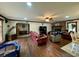 Large living room with hardwood floors, fireplace, and comfy seating at 4575 Saints Delight Rd., Georgetown, SC 29440