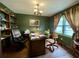 Home office with wood desk, chair, and built-in shelving at 4575 Saints Delight Rd., Georgetown, SC 29440