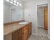 Bathroom with wood vanity and large mirror at 6703 Jefferson Pl. # B2, Myrtle Beach, SC 29572
