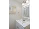 Small bathroom with white vanity and framed mirror at 6703 Jefferson Pl. # B2, Myrtle Beach, SC 29572