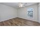 Bright bedroom with wood-look floors and ceiling fan at 6703 Jefferson Pl. # B2, Myrtle Beach, SC 29572