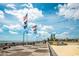 Beachfront boardwalk with ocean views and flags at 6703 Jefferson Pl. # B2, Myrtle Beach, SC 29572