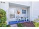 Exterior view of home with small patio and seating area at 6703 Jefferson Pl. # B2, Myrtle Beach, SC 29572