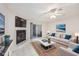 Virtually staged living room with fireplace and patio access at 6703 Jefferson Pl. # B2, Myrtle Beach, SC 29572