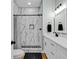 Clean bathroom with white cabinets and marble-tiled shower at 6001 - 1778 S Kings Hwy., Myrtle Beach, SC 29575