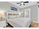King-size bed in bright bedroom with wood floors and TV at 6001 - 1778 S Kings Hwy., Myrtle Beach, SC 29575