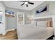 King-size bed in bright bedroom with wood floors and TV at 6001 - 1778 S Kings Hwy., Myrtle Beach, SC 29575