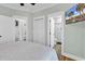 King-size bed in bright bedroom with wood floors and en-suite bath at 6001 - 1778 S Kings Hwy., Myrtle Beach, SC 29575