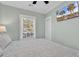 King-size bed in bright bedroom with wood floors and TV at 6001 - 1778 S Kings Hwy., Myrtle Beach, SC 29575