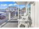 Relaxing deck with white chairs and a view of the neighborhood at 6001 - 1778 S Kings Hwy., Myrtle Beach, SC 29575