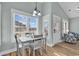 Bright dining area with white table and chairs; coastal decor at 6001 - 1778 S Kings Hwy., Myrtle Beach, SC 29575