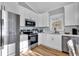 Modern kitchen with stainless steel appliances and white cabinets at 6001 - 1778 S Kings Hwy., Myrtle Beach, SC 29575