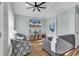 Bright living room with comfy seating, large TV, and hardwood floors at 6001 - 1778 S Kings Hwy., Myrtle Beach, SC 29575
