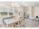 Bright dining area with a wooden table and chairs, and a view of the backyard at 6025 Mcclain Ct., Little River, SC 29566