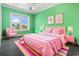 Charming bedroom with pink accents and a comfortable bed at 8030 Wacobee Dr., Myrtle Beach, SC 29579