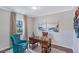 Well-lit office space with wooden desk, blue accent chair, and decorative wall art at 873 Agostino Dr., Myrtle Beach, SC 29579