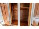 This is an interior view of a closet with wood flooring and wood plank walls and shelving at 2110 4Th Ave., Conway, SC 29527