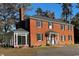 Charming red brick home with a sunroom addition and landscaped yard at 2110 4Th Ave., Conway, SC 29527