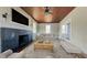 Cozy living room with a black fireplace, wood ceiling, and neutral furniture at 2110 4Th Ave., Conway, SC 29527