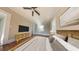 This bedroom features hardwood floors, a ceiling fan, and a dresser with a TV on top at 2110 4Th Ave., Conway, SC 29527