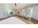 This bedroom boasts hardwood floors, a ceiling fan, and a bathroom adjacent to it at 2110 4Th Ave., Conway, SC 29527