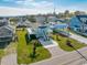 Aerial view of a light blue beach house with a deck and surrounding homes at 243 Calhoun Dr., Garden City Beach, SC 29576
