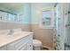 Clean bathroom with a white vanity, shower/tub combo and nautical decor at 243 Calhoun Dr., Garden City Beach, SC 29576