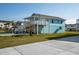 Two-story home with light blue siding, deck, and stairs at 243 Calhoun Dr., Garden City Beach, SC 29576