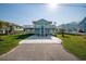 Cute light blue home with a two-car garage and deck at 243 Calhoun Dr., Garden City Beach, SC 29576
