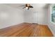Bright living room featuring hardwood floors and a ceiling fan at 243 Calhoun Dr., Garden City Beach, SC 29576