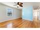 Living room with hardwood floors and light blue accent wall at 243 Calhoun Dr., Garden City Beach, SC 29576