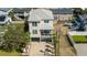 Aerial view of an elevated beach home showcasing its convenient location and parking at 302A 32Nd Ave. N, North Myrtle Beach, SC 29582