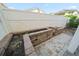 Backyard with a brick-lined garden featuring a paved patio area at 302A 32Nd Ave. N, North Myrtle Beach, SC 29582