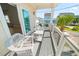 Charming outdoor balcony with seating, features beautiful neighborhood view with other well kept homes at 302A 32Nd Ave. N, North Myrtle Beach, SC 29582