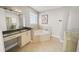 Bathroom features a bathtub, a double vanity, a glass shower, and tile floors at 302A 32Nd Ave. N, North Myrtle Beach, SC 29582