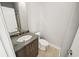 Powder room features stone counter, modern faucet, and light wood tile floor at 302A 32Nd Ave. N, North Myrtle Beach, SC 29582